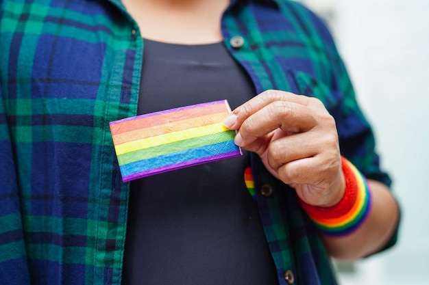 Asian woman with rainbow flag LGBT symbol rights and gender equality LGBT Pride Month in June