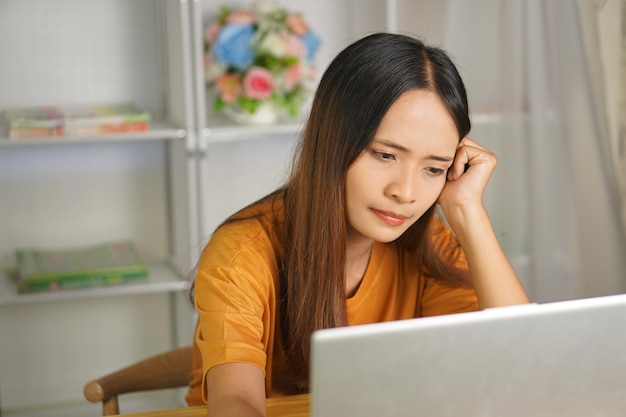 Asian woman working from home Tired of paperwork that is not completed on time