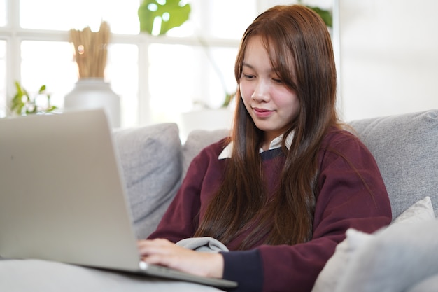 Asian woman working from home