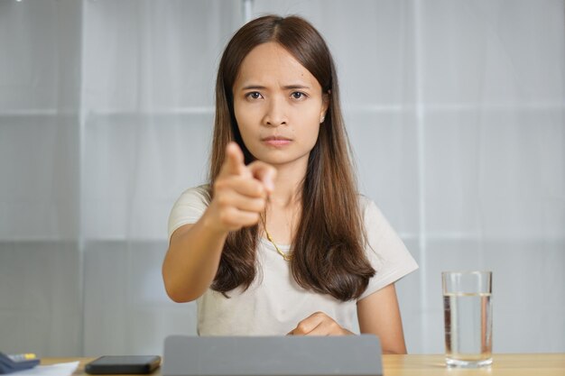 Asian woman working at home Scold the employee for making a mistake