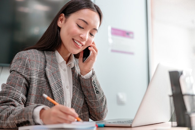 Asian woman working in IT office