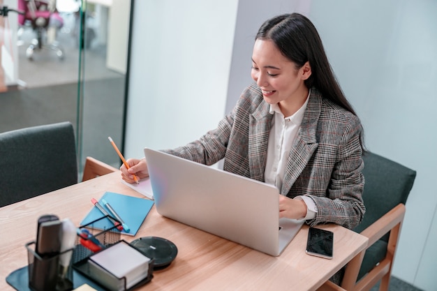 Asian woman working in IT office