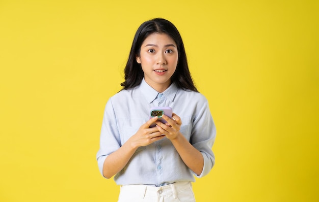 Asian woman on yellow background