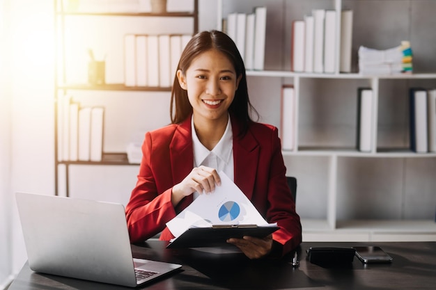 Asian women are stressed while working on laptop Tired asian businesswoman with headache at office feeling sick at work copy space