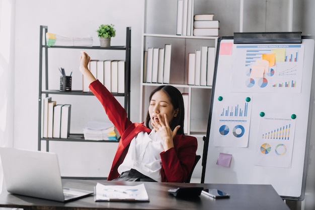 Asian women are stressed while working on laptop Tired asian businesswoman with headache at office feeling sick at work copy space