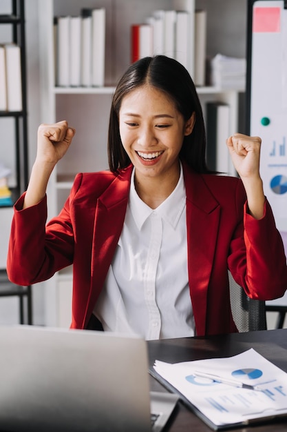 Asian women are stressed while working on laptop Tired asian businesswoman with headache at office feeling sick at work copy space