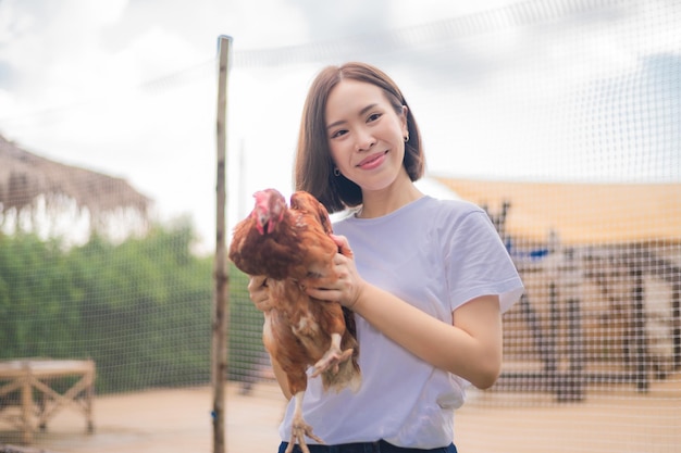 Asian women in chickens farm