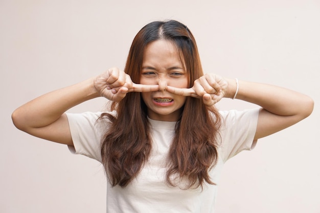 Asian women cover their noses with their hands because they smell badx9