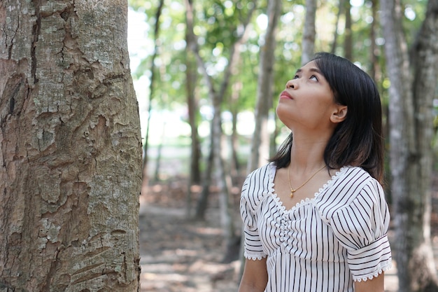 Asian women explore trees, love the world concept