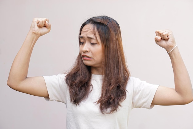 Asian women flex their muscles and show their strength