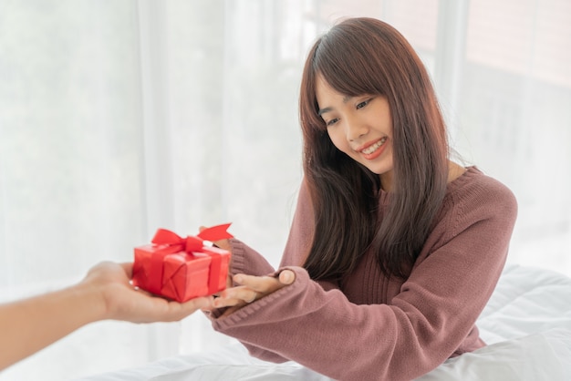 Asian women happy to receive a gift box