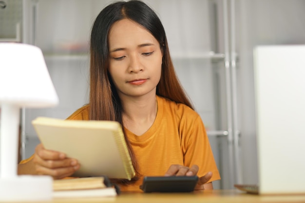 Asian women press to work from home Click on the calculator to see profits