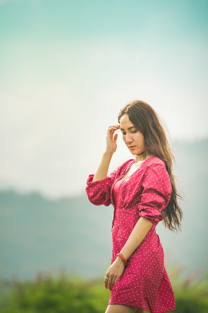 Asian women in red dress on sunrise