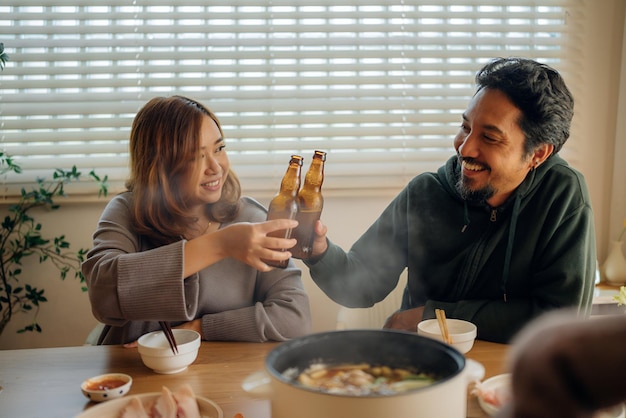 Asian women share a meal with friends at home celebrating the holiday