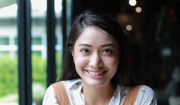 Asian women smiling and happy and enjoyed at coffee and restaurant on relax time