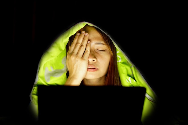 Asian women suffer from eyestrain from looking at computers in low light watch movies online