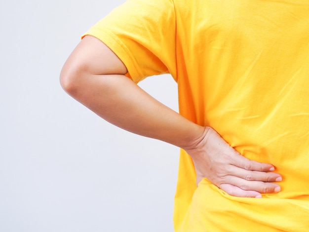 Asian women suffering from chronic back pain and lumbago herniated disc