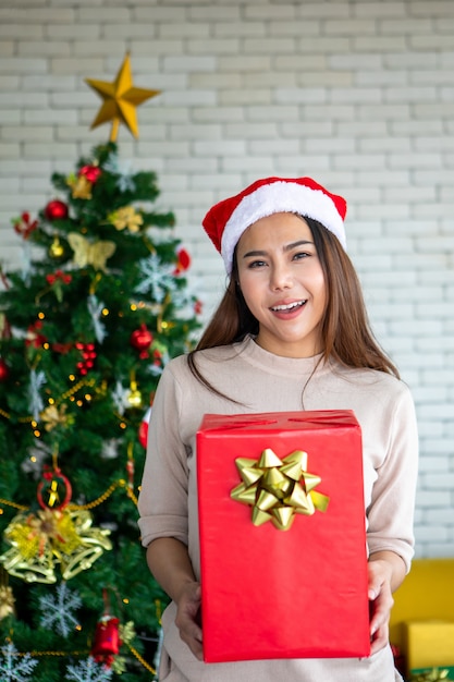 Asian women wearing Santa hat with gift boxe.christmas, x-mas, new year, winter, happiness concept.