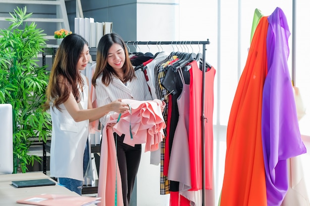 Asian women at work are fashion designers and tailors