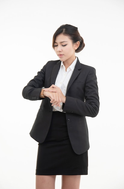 Asian young beautiful business woman dress in black suit and short skirt with smart watch