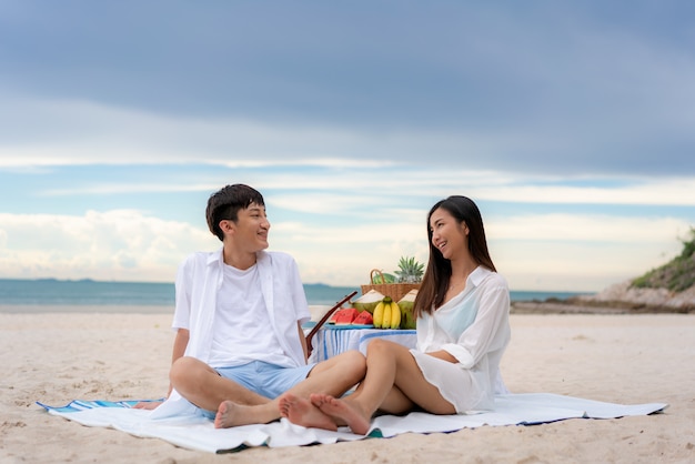 Asian young couple on the beach