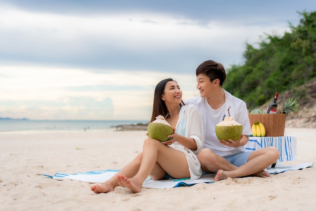 Asian young couple on the beach