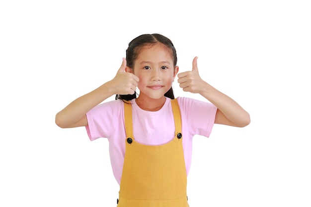 Asian young girl child show two thumbs up isolated over white background.