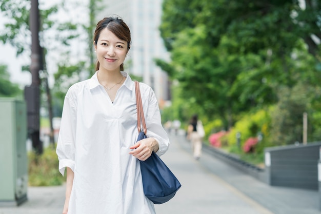 Asian young housewife with shopping bag