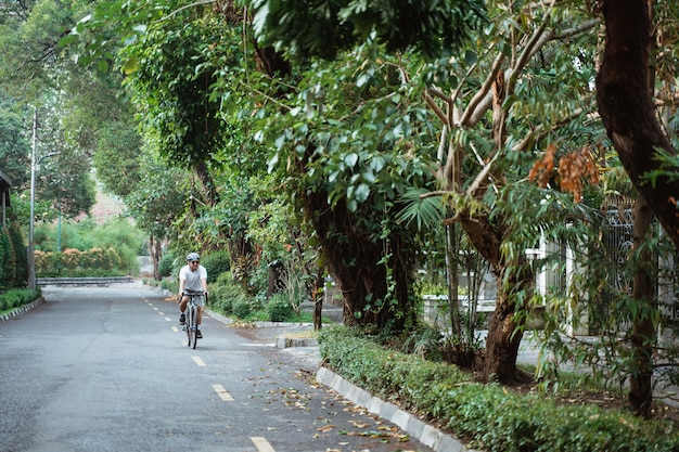 Asian young man ride road bikes