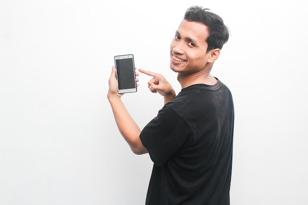 Asian young man with cheerful hand gesture shows his cellphone Advertising model concept