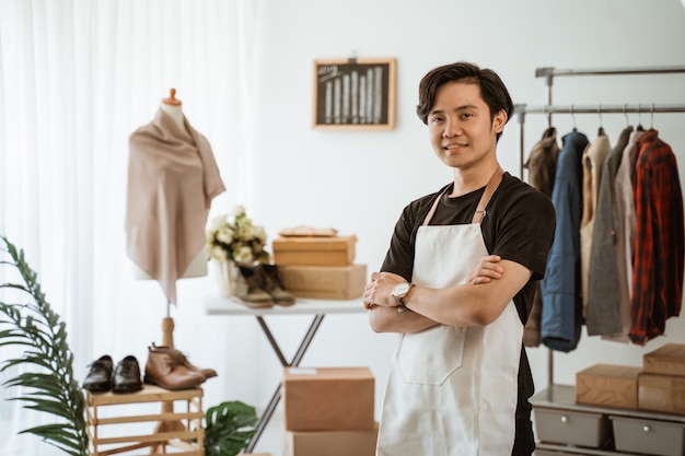 Asian young man working in a clothing store