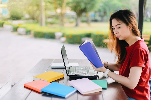 Asian young woman are searching for information on the internet.