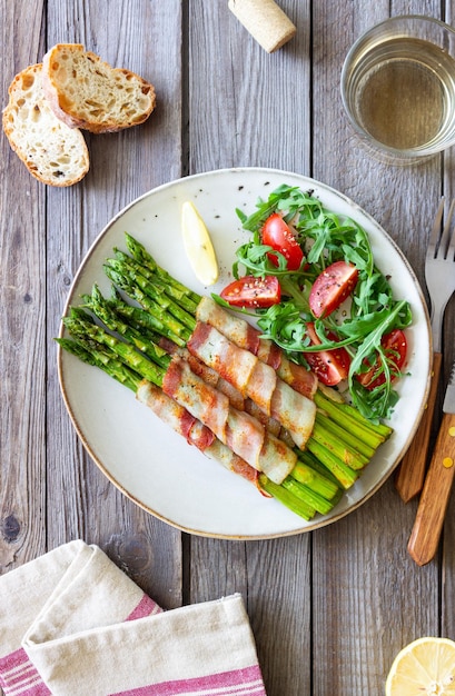 Asparagus baked with bacon and arugula and tomato salad Healthy eating Diet