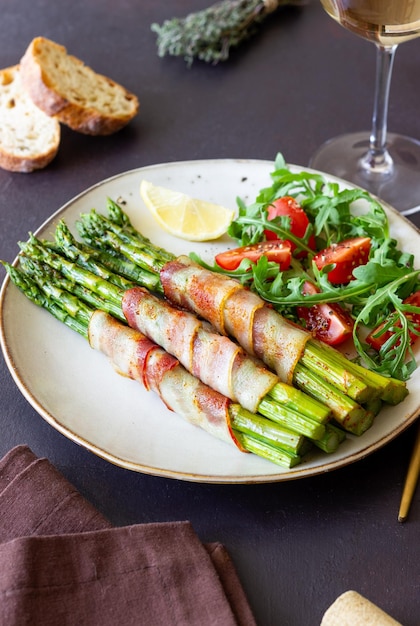 Asparagus baked with bacon and arugula and tomato salad Healthy eating Diet