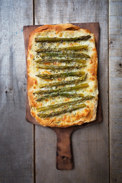 Asparagus green pizza with herbs and mozzarella