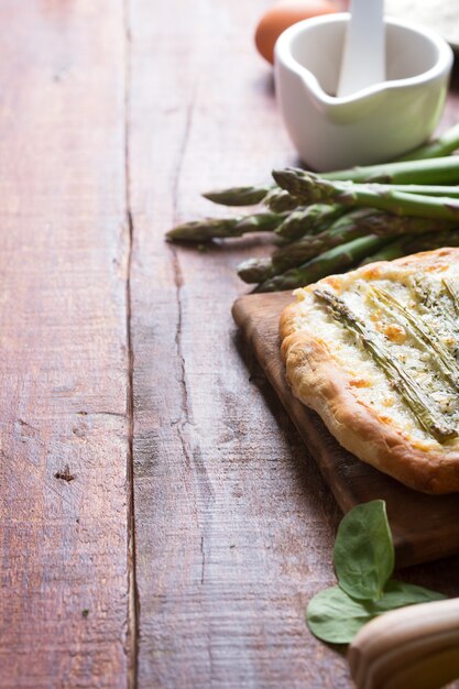 Asparagus green pizza with herbs and mozzarella