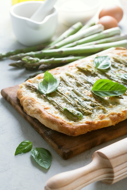 Asparagus green pizza with herbs and mozzarella