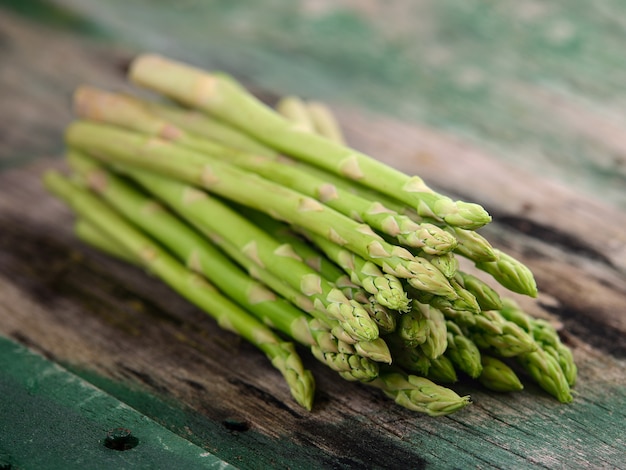 Asparagus on old wooden table