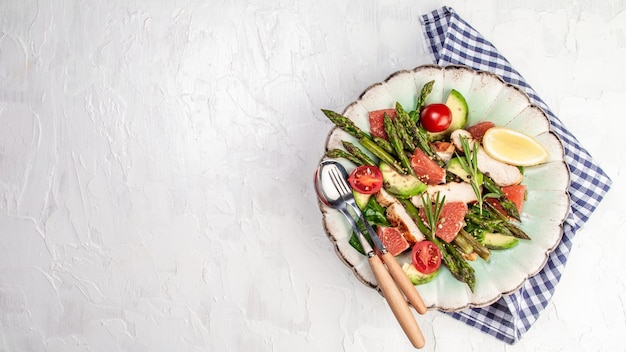 Asparagus salad Salad bowl with copy space Delicious breakfast or snack on a light background top view