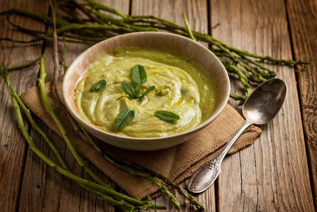 Asparagus soup with mint leaf