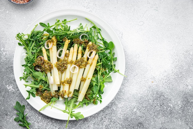 asparagus white bean salad arugula green leaf lettuce healthy meal food snack on the table