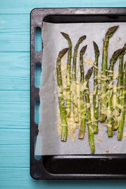 Asparagus with cheese baked in the oven