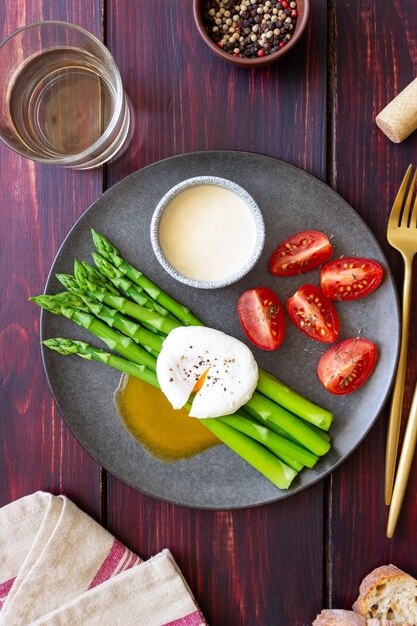 Asparagus with poached egg tomatoes and hollandaise sause Healthy eating Vegetarian food