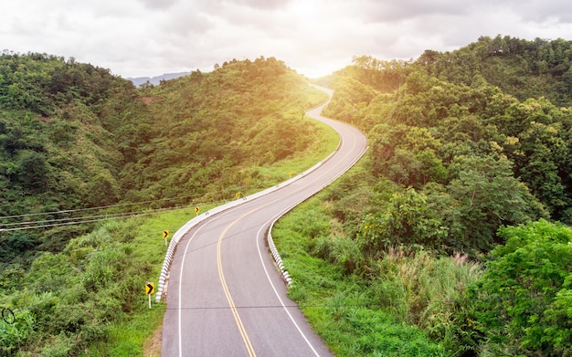 Asphalt curved highway on mountain background