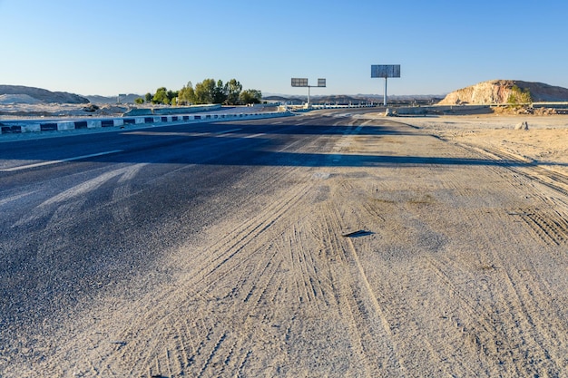 Asphalt road in arabian desert not far from the Hurghada city Egypt