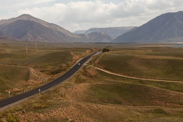 asphalt road. The Bishke Osh road around the Toktogul water reservoir. Kyrgyzstan