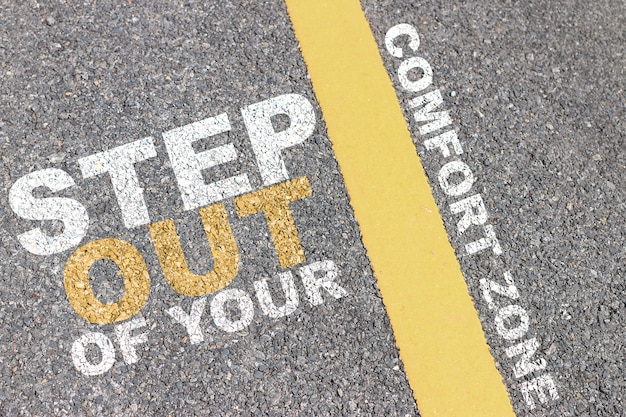 The asphalt road has a yellow stripe, Inspiration typographic quotes.