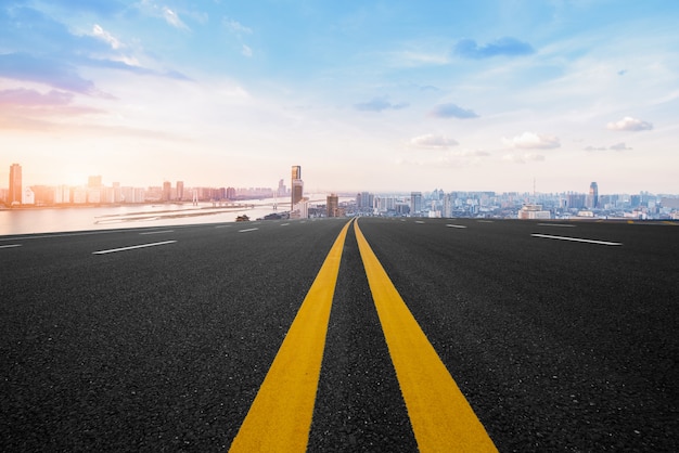 Asphalt road and modern city