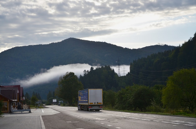 Asphalt road in the mountainous terrain in the morning