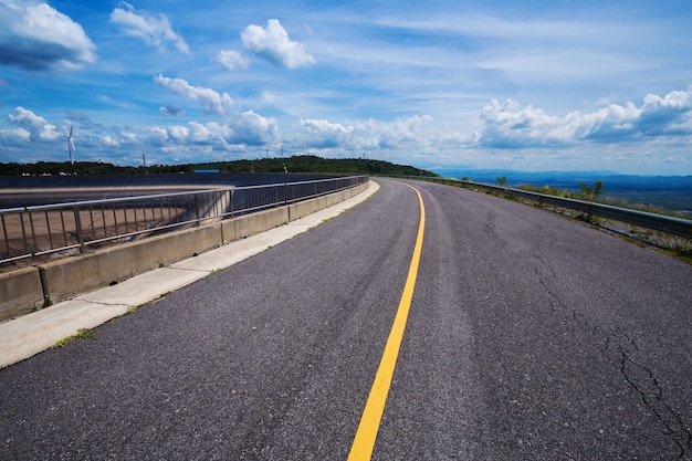 asphalt road with blue sky